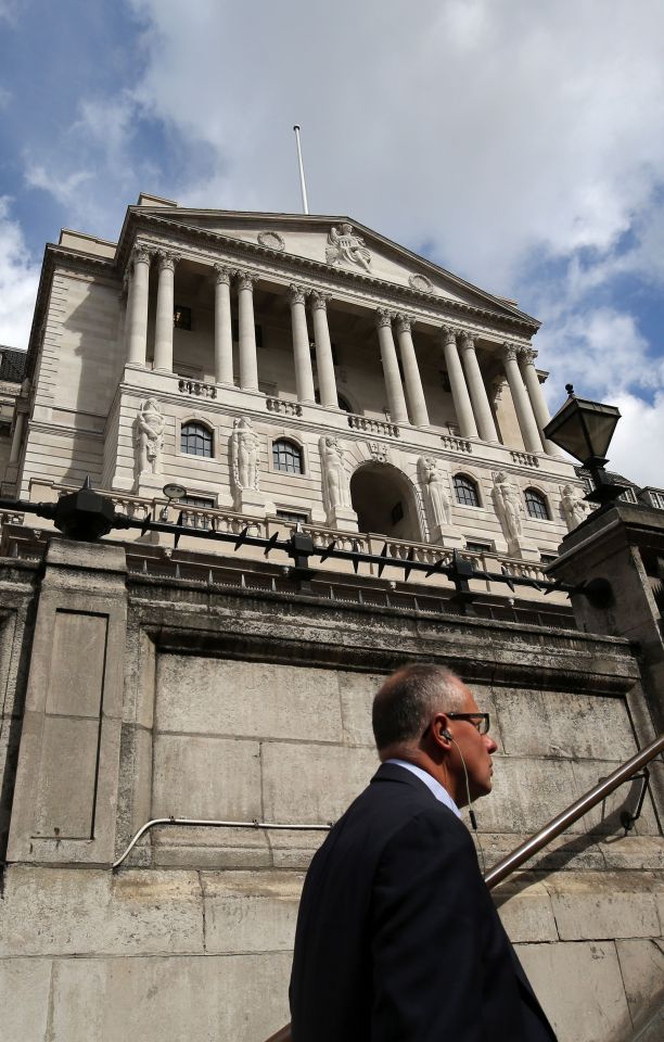 A man walks past the Bank of England in