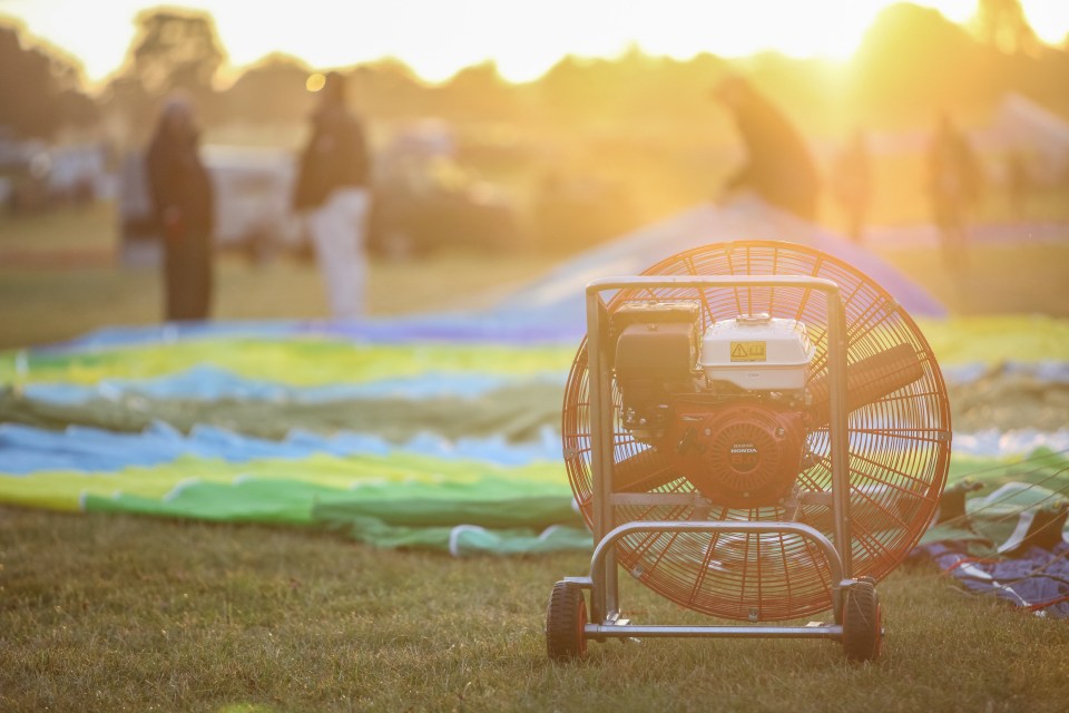 An engine lies in wait to fill a balloon with hot gas to send it soaring skyward and glide over Bristol