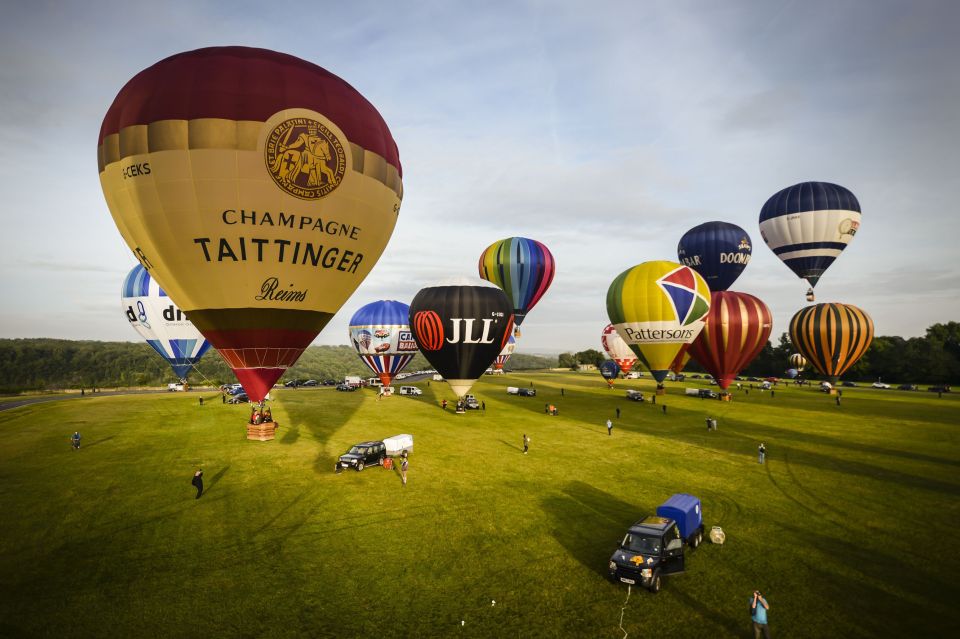 A balloon promoting Tattinger champagne inflates ready for take off on Clifton Downs near Bristol