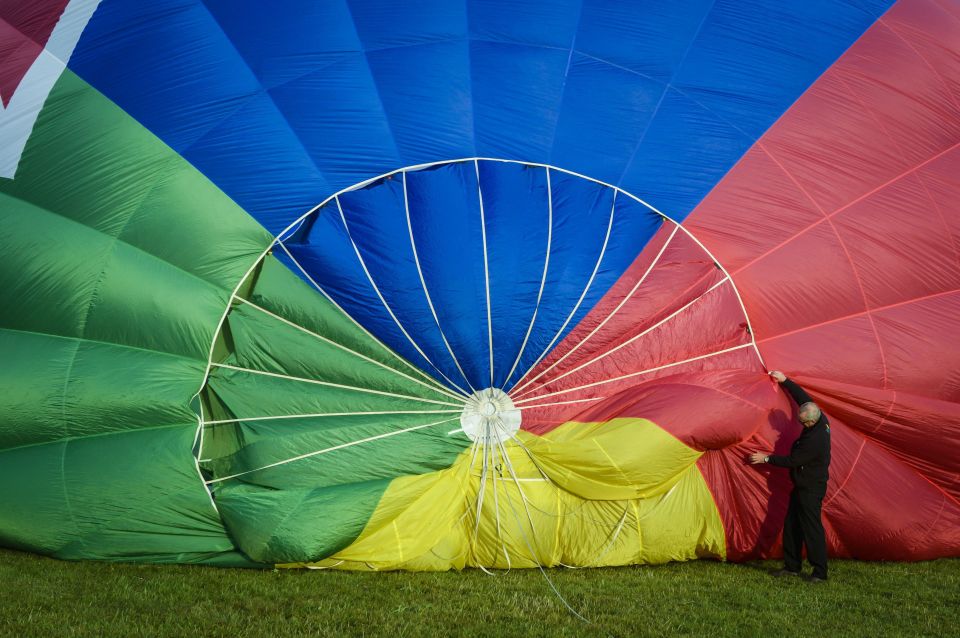 A pilot checks his balloon in preparation for flight to publicise the free event