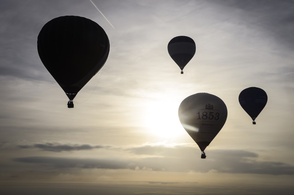 As dawn broke the sky filled with brightly coloured orbs emblazoned with a raft of sponsors 
