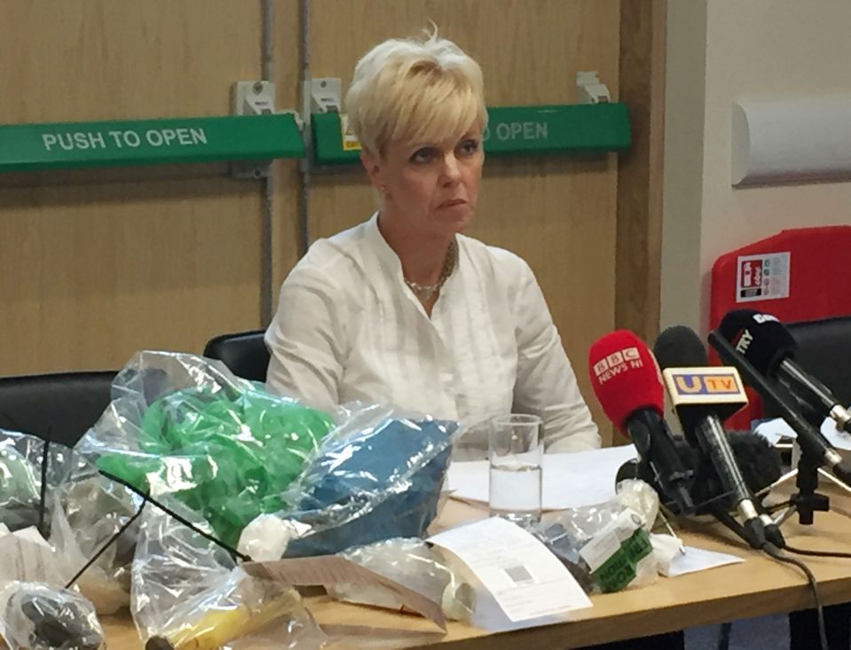 Detective Superintendent Karen Baxter displays some of the weapons found as she speaks to the media
