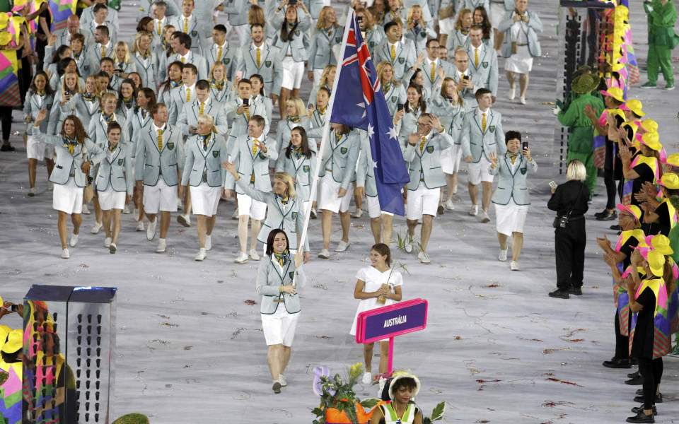 The Australian team enter the stadium led by flagbearer, cyclist Anna Meares