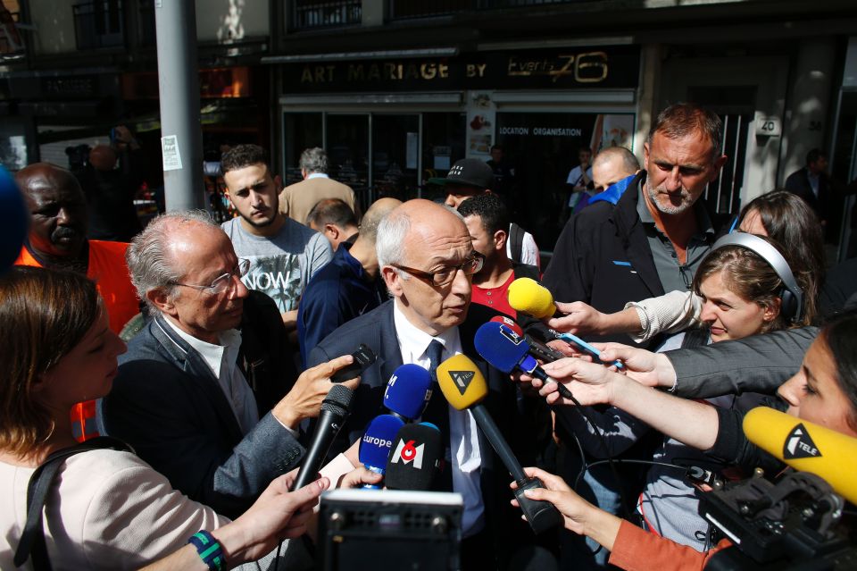Rouen's mayor Yvon Robert (C) speaks to