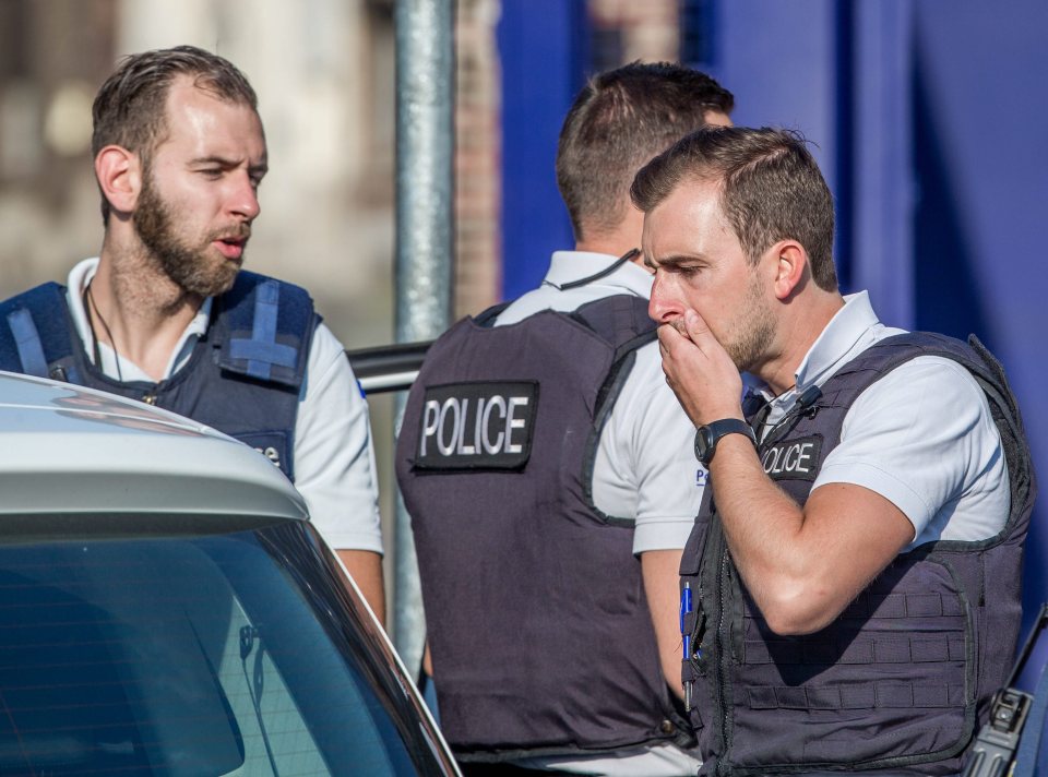 Two Police officers injured by a machete-wielding assailant.