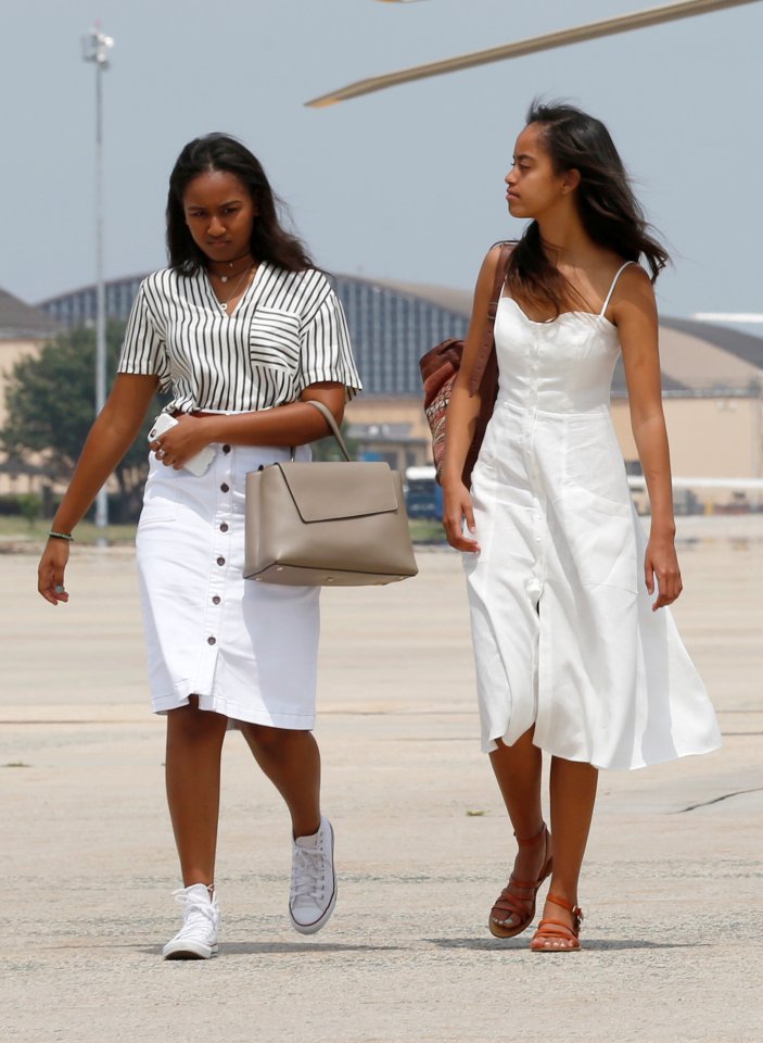 U.S. President Barack Obama's daughters Sasha, left, and Malia, right. The girls have grown up in the spotlight due to their father