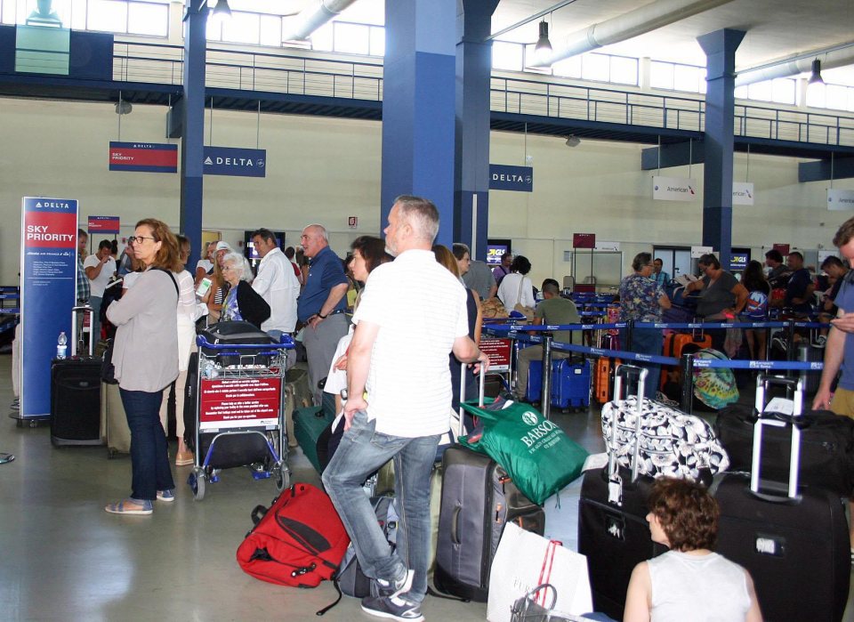 Passengers waiting to board Delta Airlines flights at Rome's Fiumicino airport