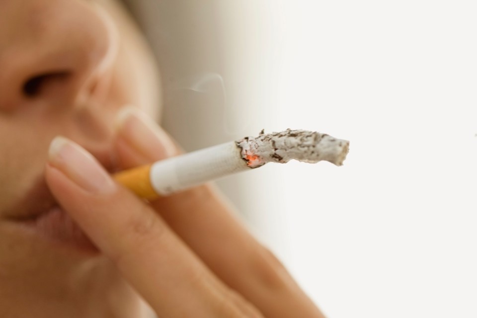 Close up of woman smoking cigarette