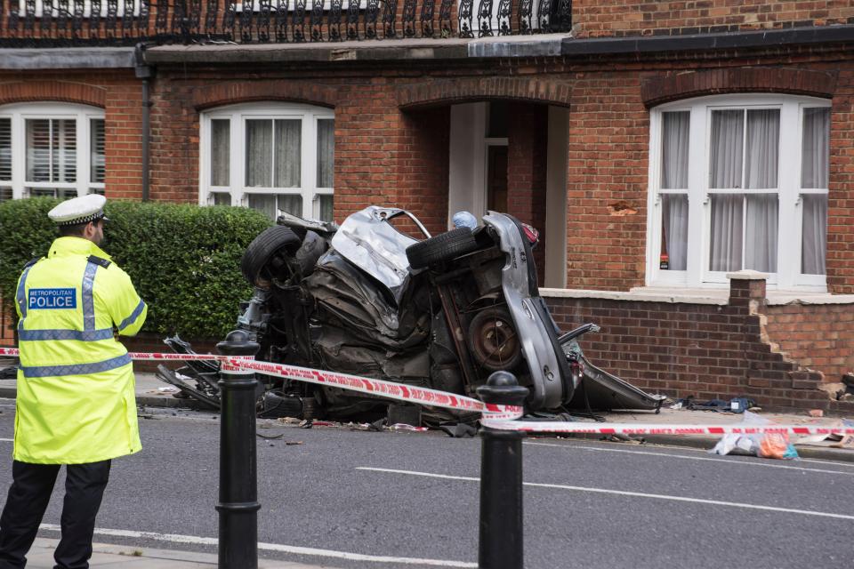 The wreckage pictured by the side of the road after the car crashed into a house