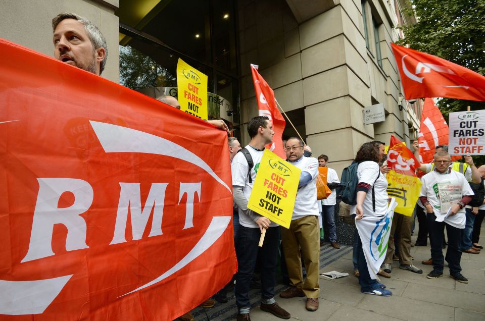 Members of the RMT union pictured demonstrating outside the Department of Transport in Westminster, London, 
