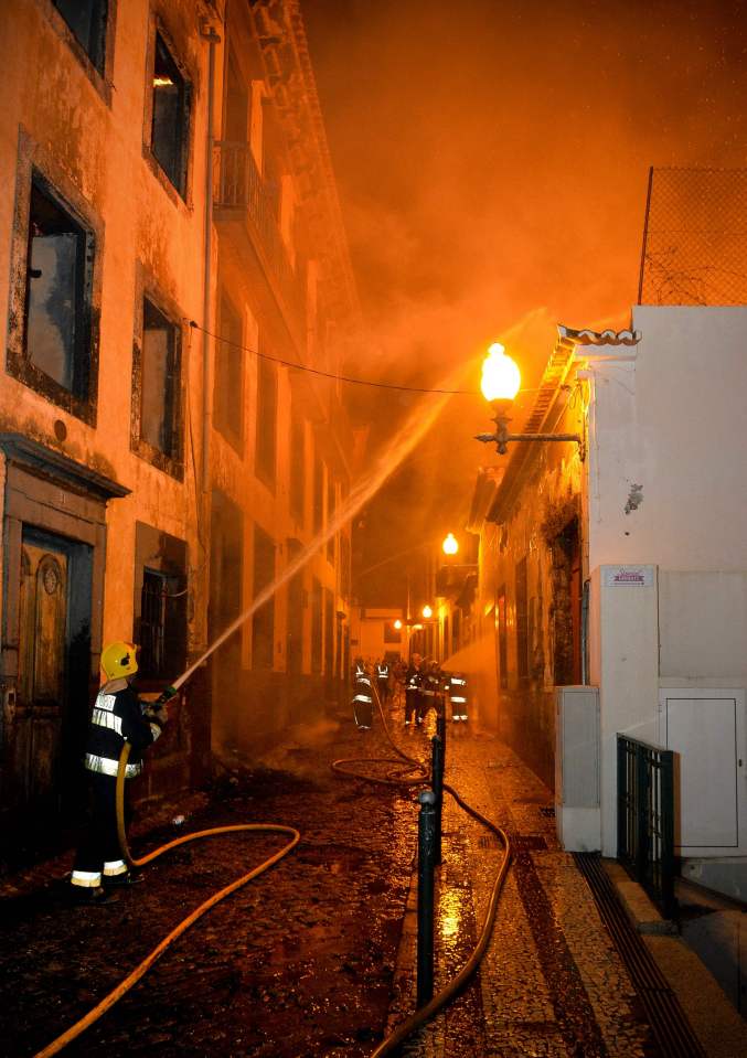 Pictures show firefighters desperately trying to save the old buildings which attract thousands to the area every year