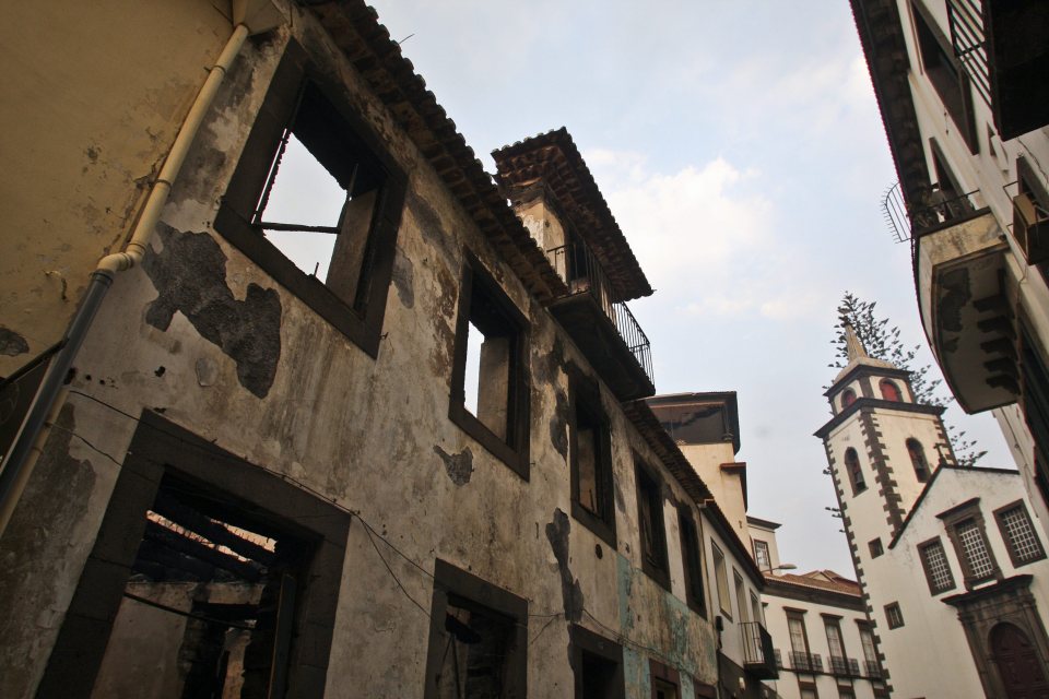 Pictures taken today show old buildings in the Sao Pedro historic quarter of the city burnt out 