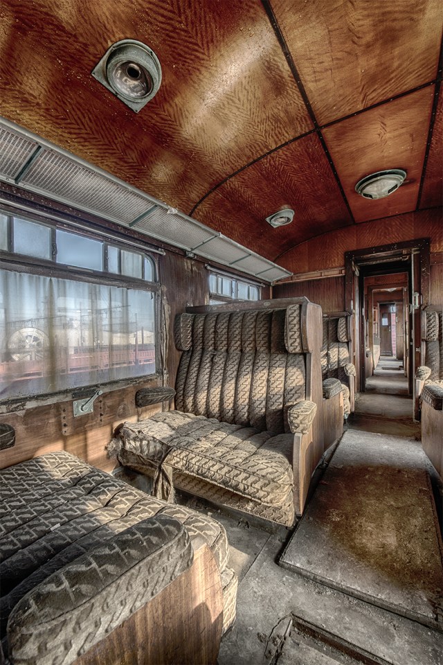 Rusty ceilings and moth-eaten seats capture the train's level of decay