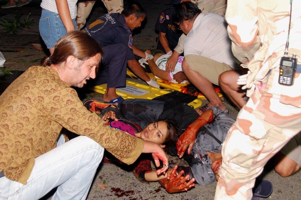 One local woman was treated on the ground by medics after being injured in the blasts