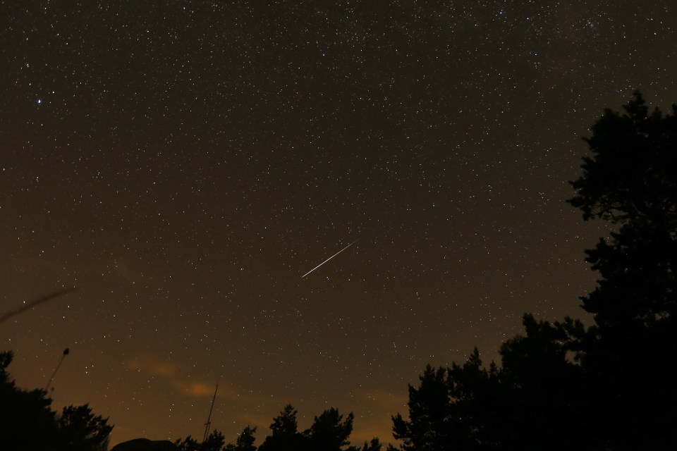 A streak appears in the sky during the annual Perseid meteor shower at the Guadarrama mountains, near Madrid