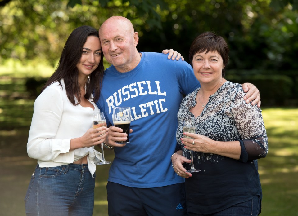 Hugs . . . family celebrate success of Sun campaign