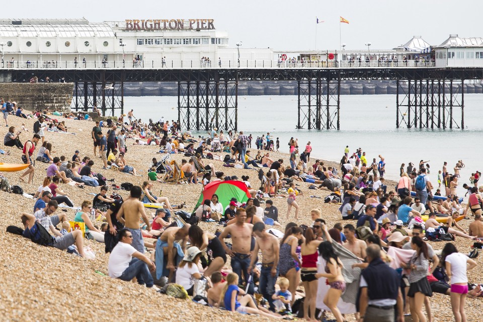Brighton Pier was inundated with people enjoying the sunshine today as the mercury pushed up to 23C