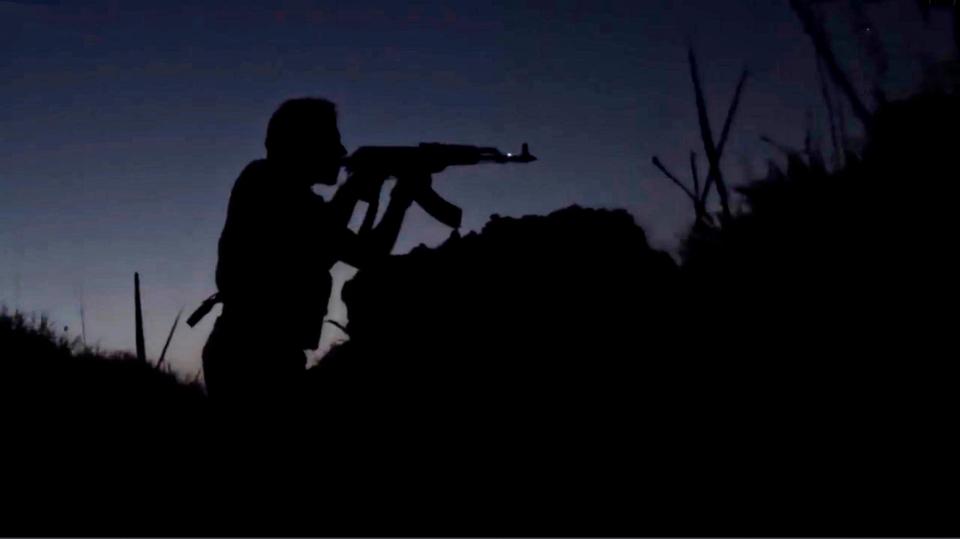 An ISIS propaganda video showing Islamic State militants silhouetted during a twilight battle along the border of Iraq and Syria in an area described as Wilayah al-Khayr January 13, 2016 near Deir ez-Zor, Syria.
