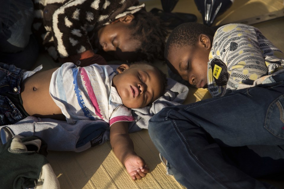 Children from Nigeria sleep on the Astral vessel after being pulled from a sinking ship in the Mediterranean 