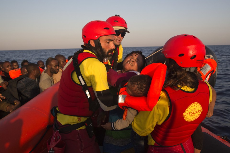 A Nigerian mother and child are rescued in the Mediterranean sea, about 17 miles north of Sabratah, Libya