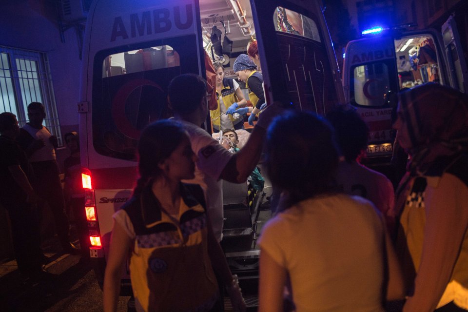 First aid officers carry an injured man