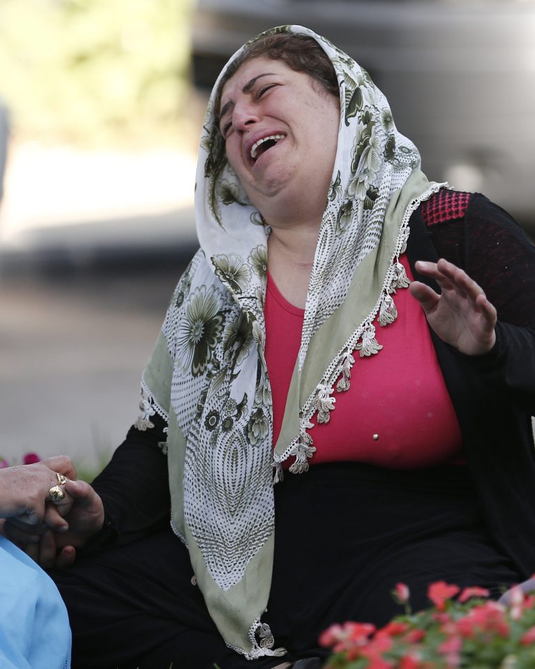 A relative of one of the victims killed weeps after the horrific attack