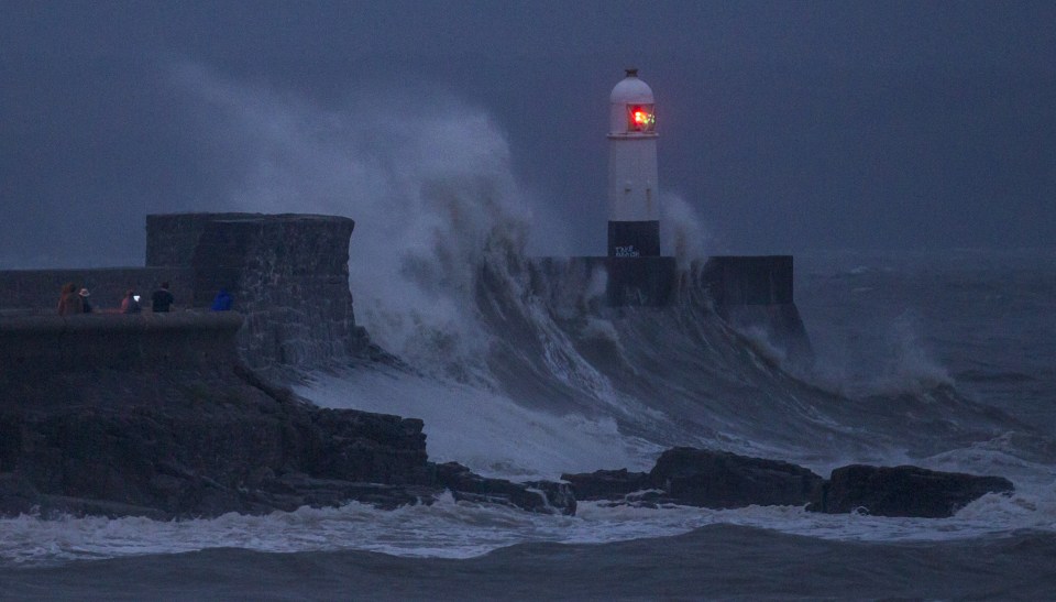 Teenagers risk their lives playing chicken with huge waves.