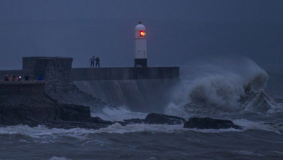 Teenagers risk their lives playing chicken with huge waves.