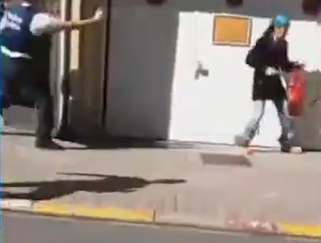 Officers point their weapons at the woman on the street in Brussels