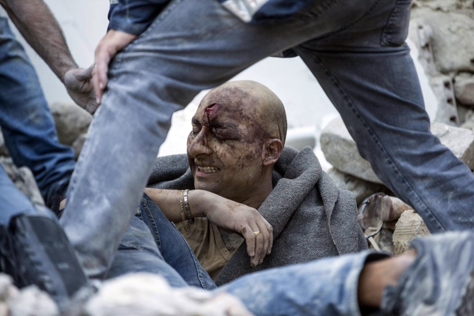 The death toll rose quickly throughout Wednesday morning as rescuers continued to pull bodies from the rubble. This man was one of the lucky surviviors