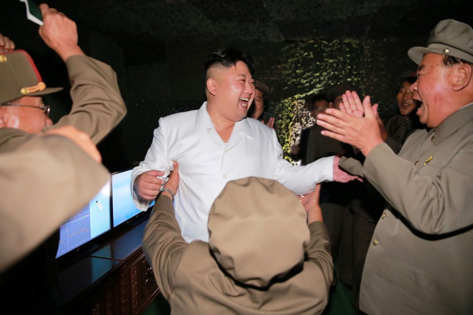 Kim Jong-Un laughed with officials as they launched the missile