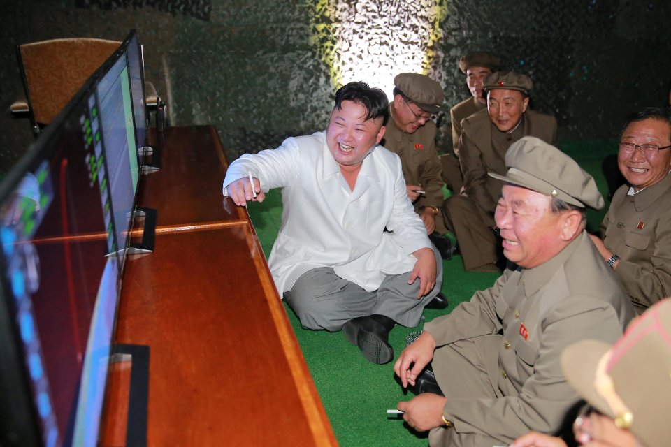 Smiling Kim watched the launch from an observation deck 