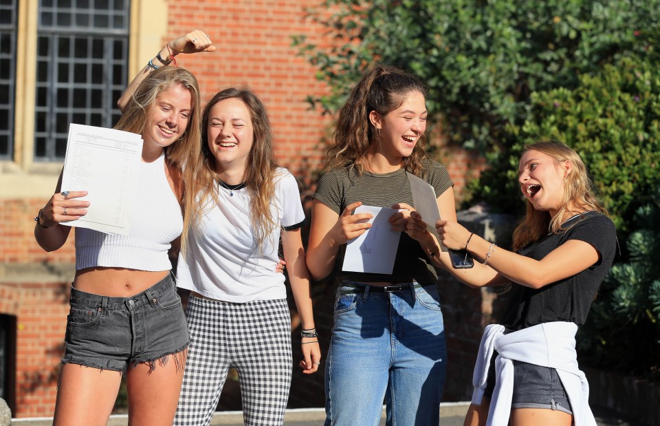 Pupils celebrate their GCSE results at Brighton College in Brighton, East Sussex 