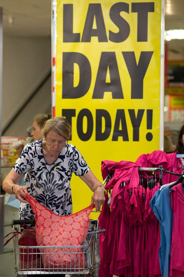 A woman shops in the retailer BHS (Briti