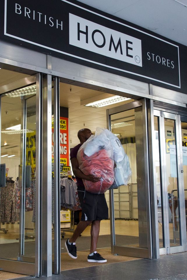 A man leaves after buying goods in the r