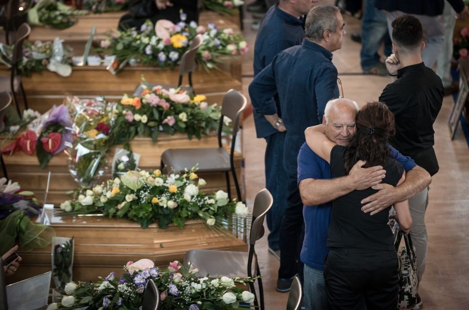 Mourning family and friends attend state funerals in Ascoli Piceno for the earthquake victims