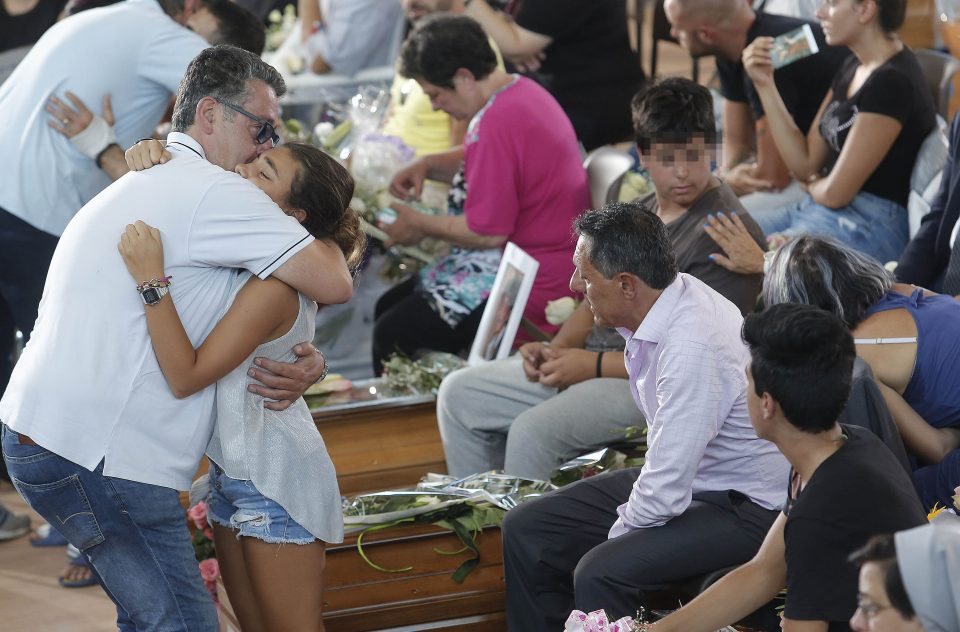 Families embrace after the horror