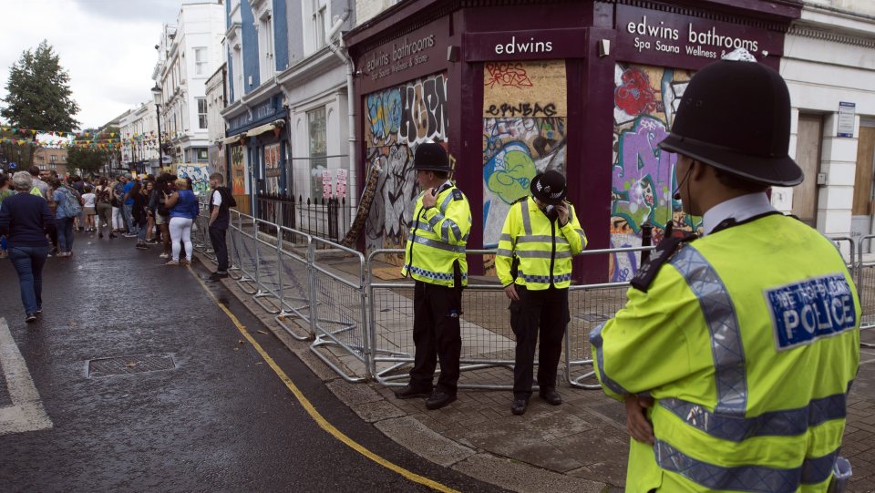 Police officers stand on duty