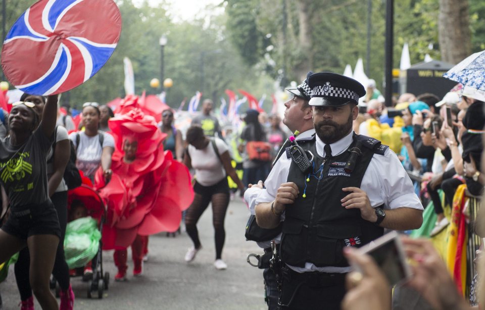 A police officer looks unamused during the Children's Day Parade