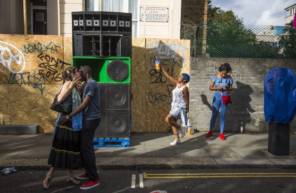 Revellers feel the groove next to a sound system