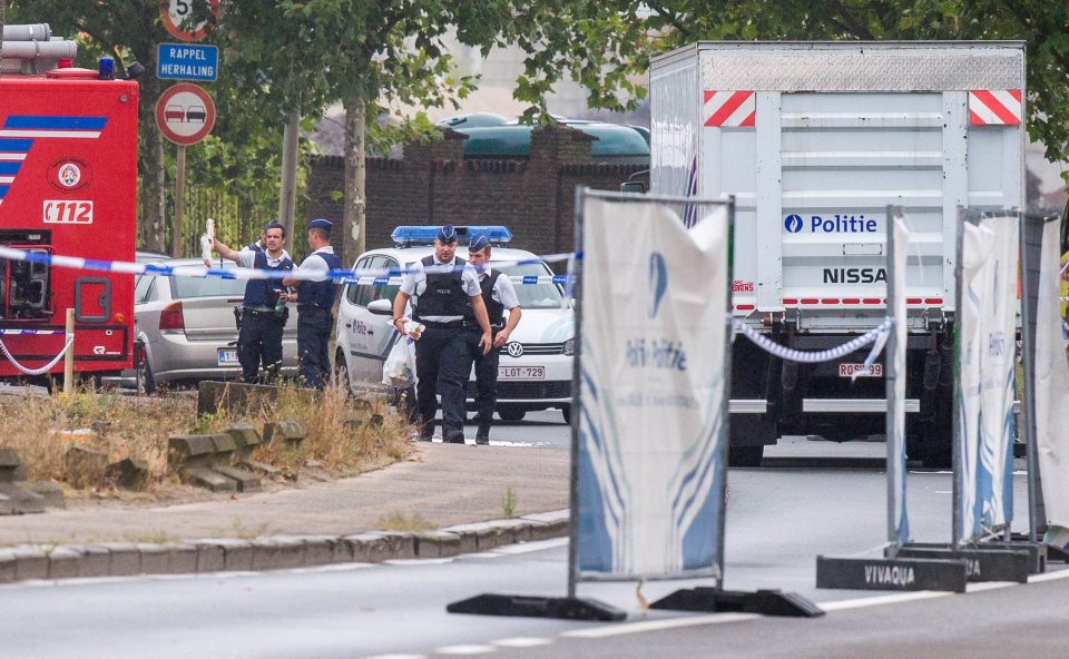 Police threw up a cordon outside the Brussels Institute of Criminology as five people were arrested nearby