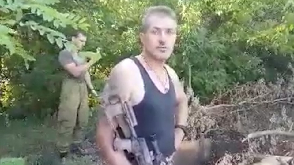 Another soldier joins in with the game as they seek yet more Pokemon in the eastern Ukraine