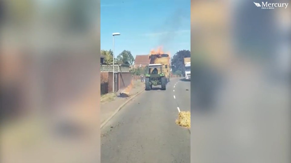 Chunks of burning hay can be seen falling from the lorry as the vehicle drives through town