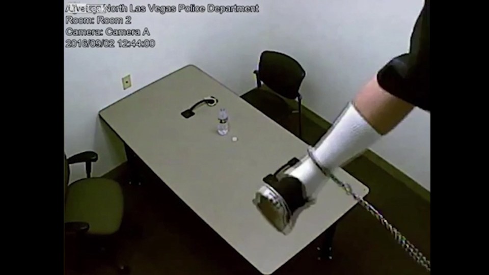 The suspect then clambers up though the ceiling, still wearing his leg shackles which can be clearly seen