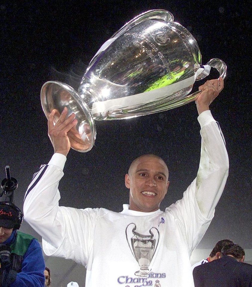 REAL MADRID V BAYER LEVERKUSEN (2-1) 15.05.2002 . Real Madrid's Roberto Carlos celebrates with the Champions League trophy after thier 2-1 victory in the UEFA Champions League Final match between Real Madrid and Bayer Leverkusen at Hampden Park stadium, Glasgow, Wednesday May 15, 2002. PA Photo: David Davies