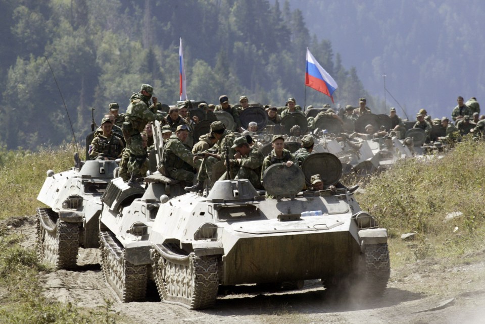 A column of Russian armoured vehicles moving toward its border