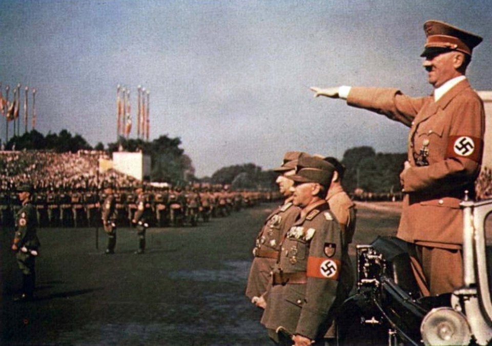 Adolf Hitler (1889-1945) Austrian-born German politician, leader of the Nazi Party. Chancellor of Germany (1933-1945) and Fuhrer und Reichskanzler of Germany (1934-1945). Hitler taking the salute at a Nazi rally.