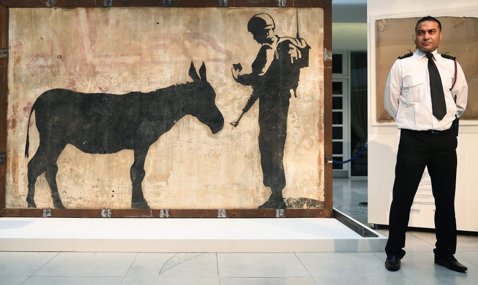 Banksy's worked have fetched as much as £500,000 at auction as he became as global art sensation