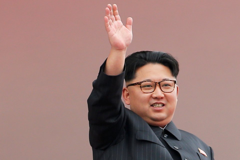 File picture of North Korean leader Kim Jong Un waving to the crowd as he presides over a mass rally and parade in the capital's main ceremonial square, in Pyongyang, North Korea