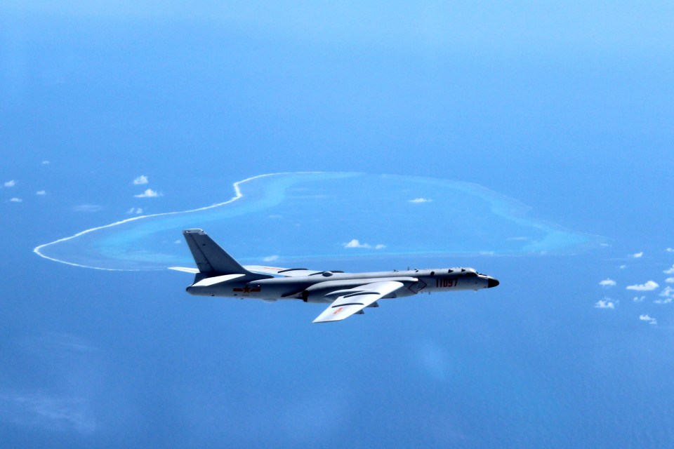 Show of force ... A Chinese H-6K bomber patrols the disputed islands in the South China Sea